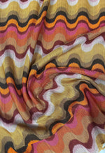 Retro wavy mesh fabric with colorful wave pattern for fashion and craft projects