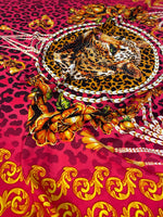 Fuchsia leopard print fabric with baroque pattern and ornate golden floral details