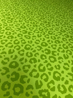 neon green leopard print fabric with bold animal pattern and 150cm width for clothing and decor projects