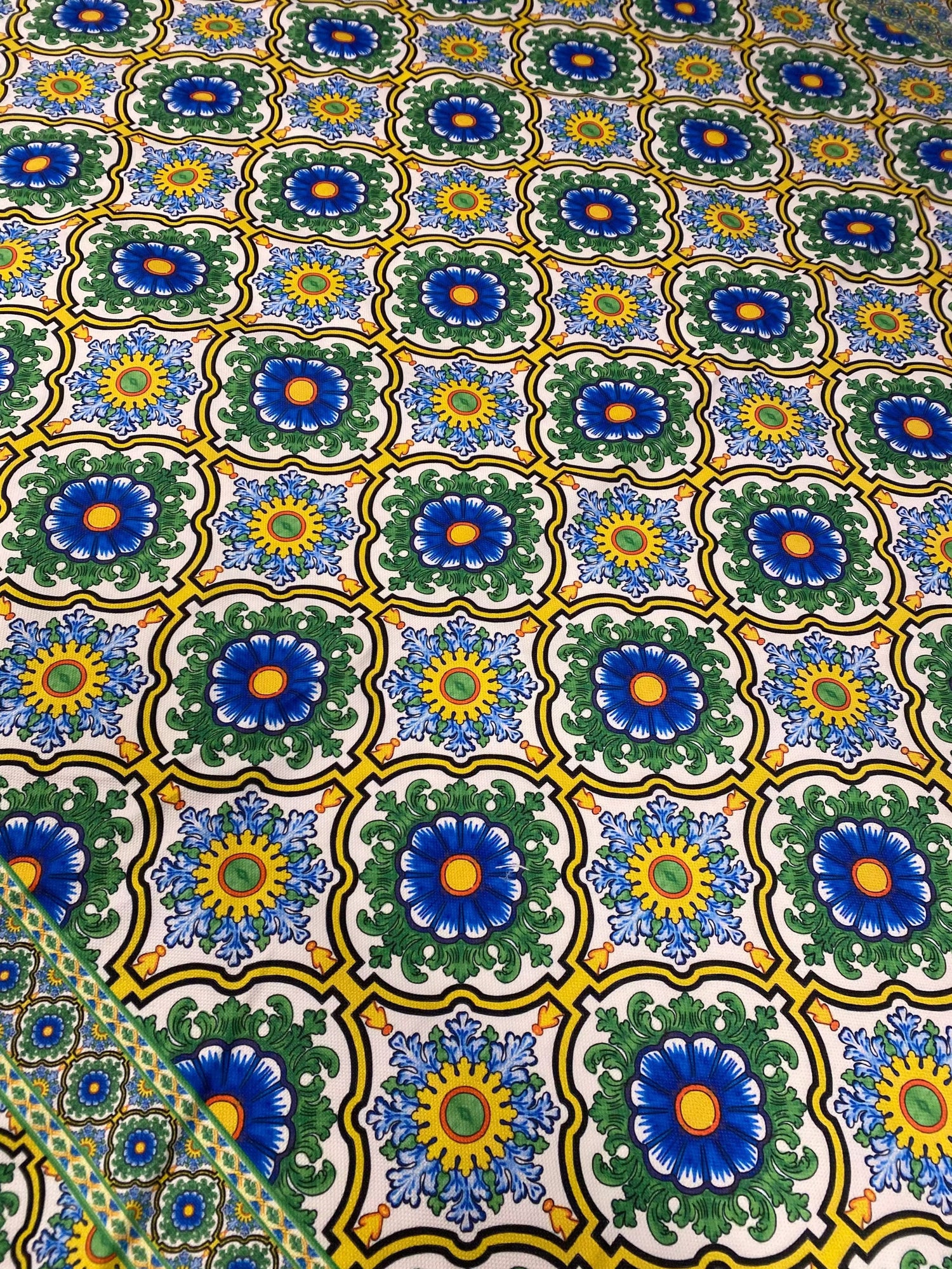 Floral design upholstery fabric with vibrant blue, green, and yellow patterns ideal for elegant home décor projects
