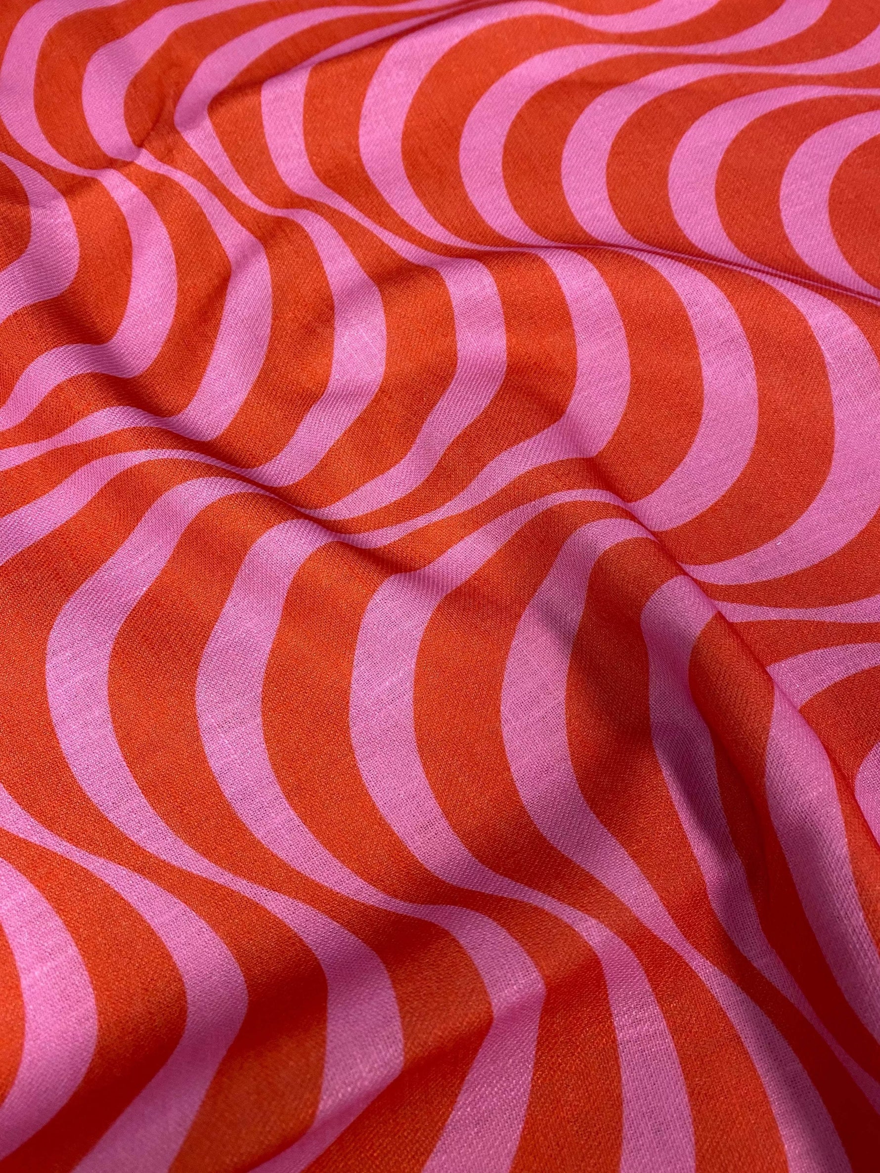 Retro wave pattern linen fabric in vibrant red and pink with smooth texture for home decor and upholstery