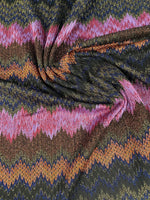 close-up of glittery zigzag mesh knitted fabric with pink, orange, blue, and green colors and shimmering texture for crafting and fashion projects