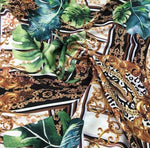 Baroque tropical green and gold fabric with ornate baroque design and tropical leaf patterns for upholstery