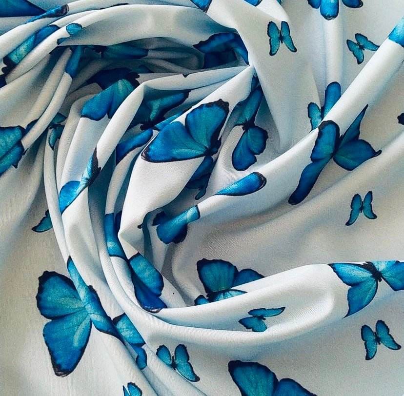 Soft fabric with baby blue butterfly print, 150cm wide for sewing and crafts
