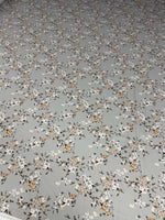 Delicate cherry blossom print fabric with soft pastel floral pattern on light grey background, sold by the yard, fabric width 150cm