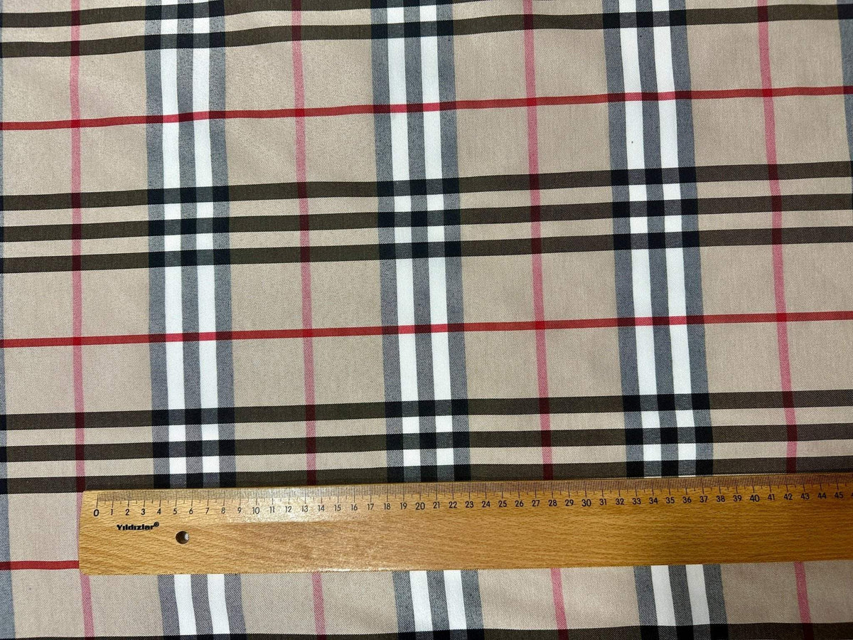 Double sided beige plaid tartan poplin cotton fabric with neutral classic check pattern and ruler for scale
