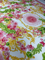 Floral & Baroque Crepe Fabric by the Metre – Pink Green Gold featuring vibrant floral patterns on a white background.