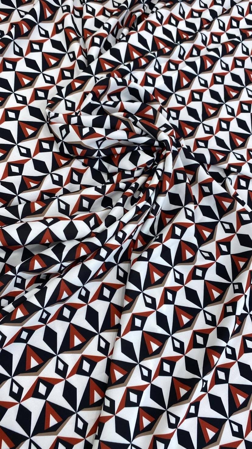 Black, red, and white geometric pattern fabric with modern abstract design, 150cm wide, ideal for sewing and crafts
