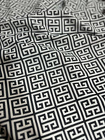 Close-up of black and white Greek Key Pattern Fabric with geometric design and 150cm width, suitable for upholstery and drapery projects