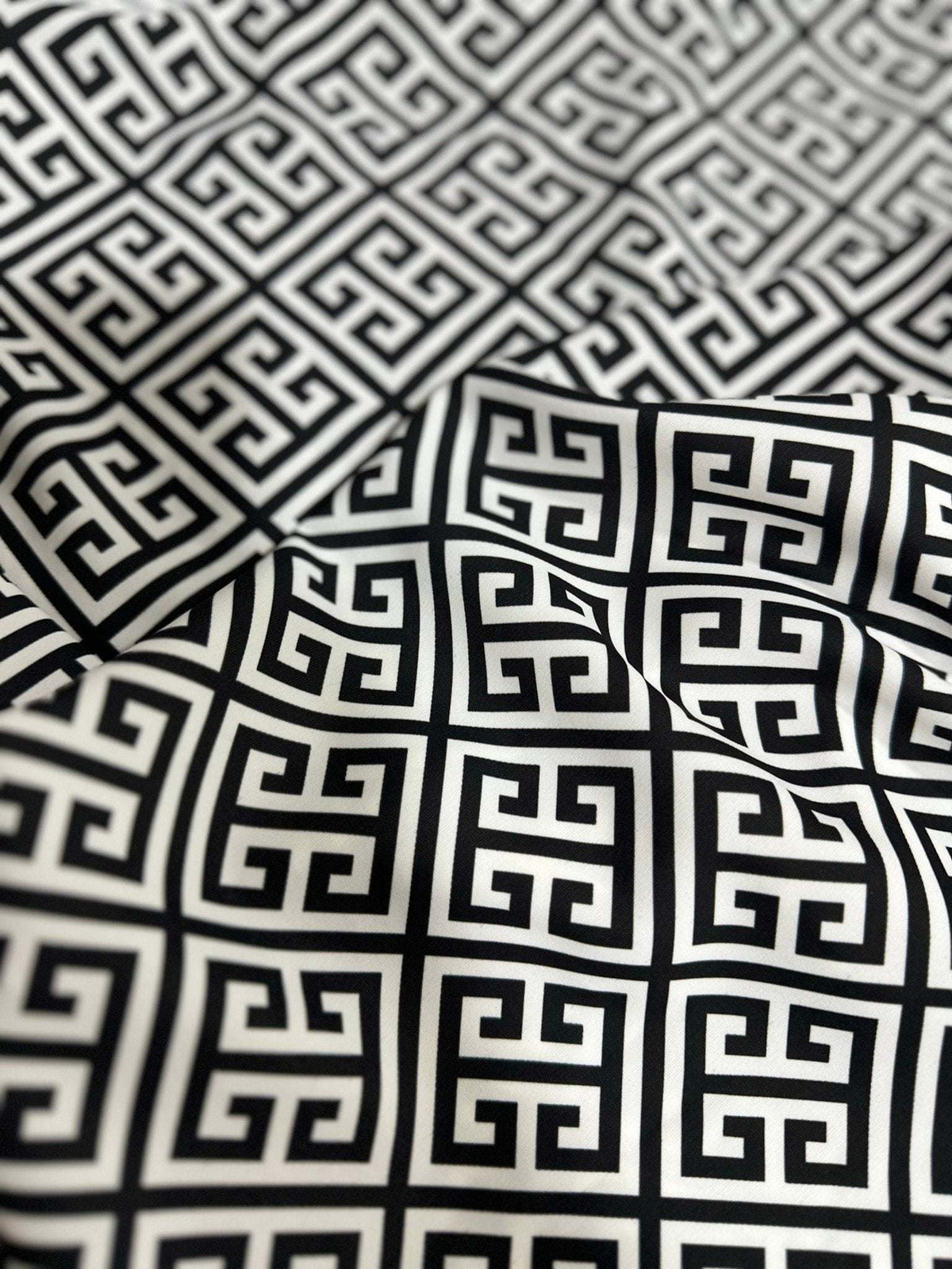 Close-up of black and white Greek Key Pattern Fabric with geometric design and soft texture