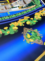 Close-up of Palm Springs Retro Hotel Print Fabric featuring vibrant cactus and yellow flower design on a deep blue background
