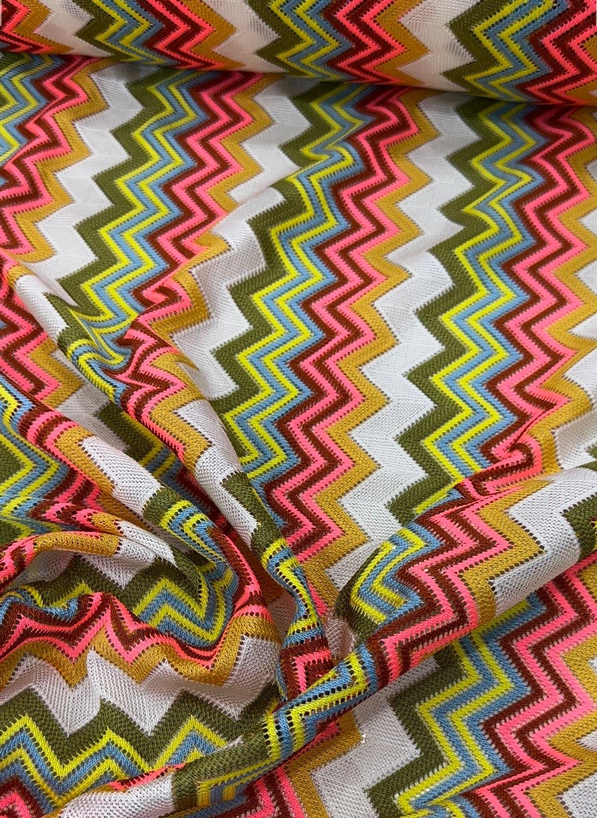 Multicolor zigzag knit jersey mesh fabric with vibrant zigzag pattern for crafting and apparel projects