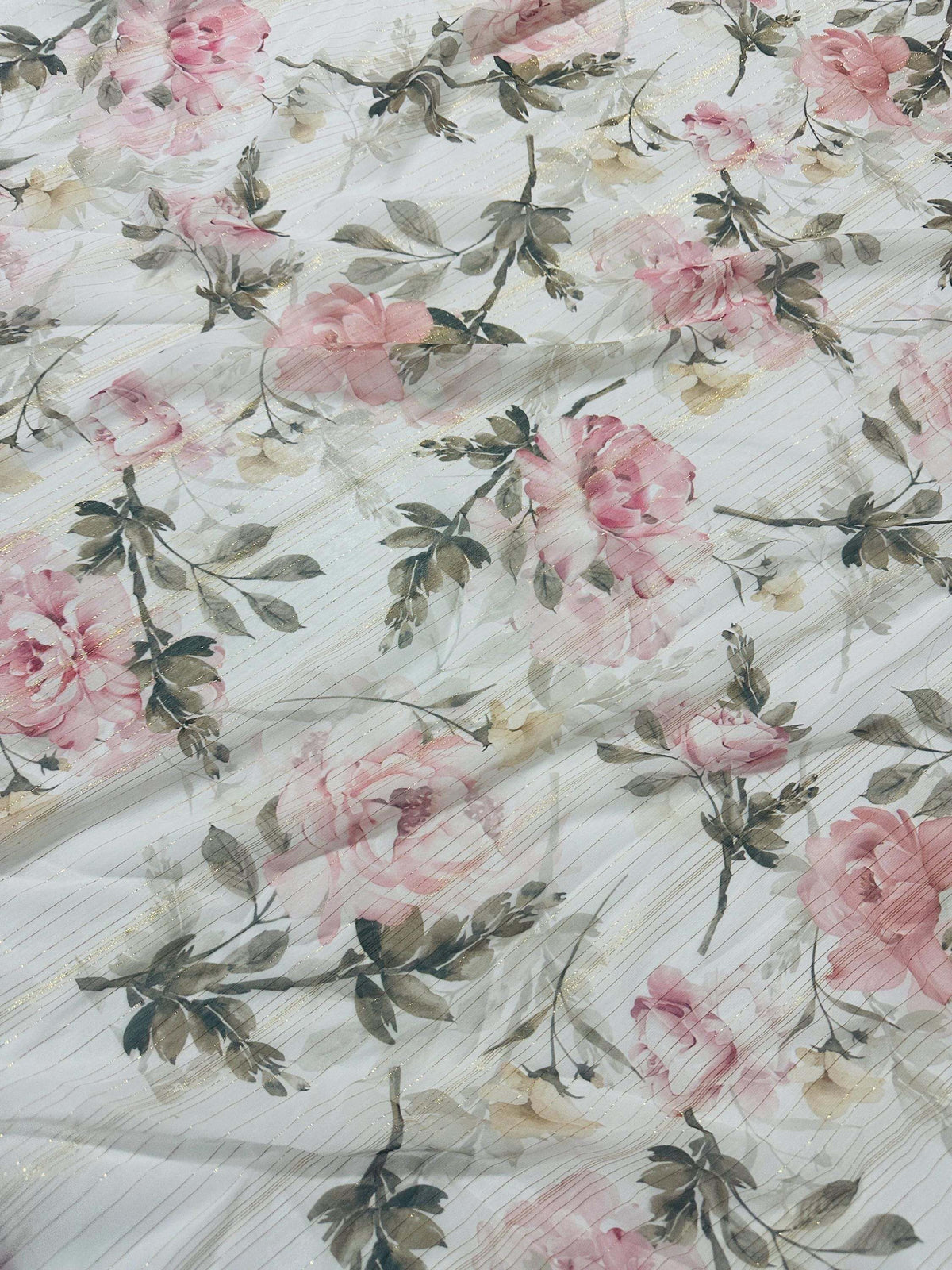 Lightweight glitter chiffon fabric with gold stripes and pink floral print for elegant sewing projects