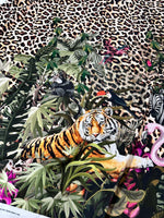 Leopard tropical leaf pattern fabric with jungle animals and leopard print background