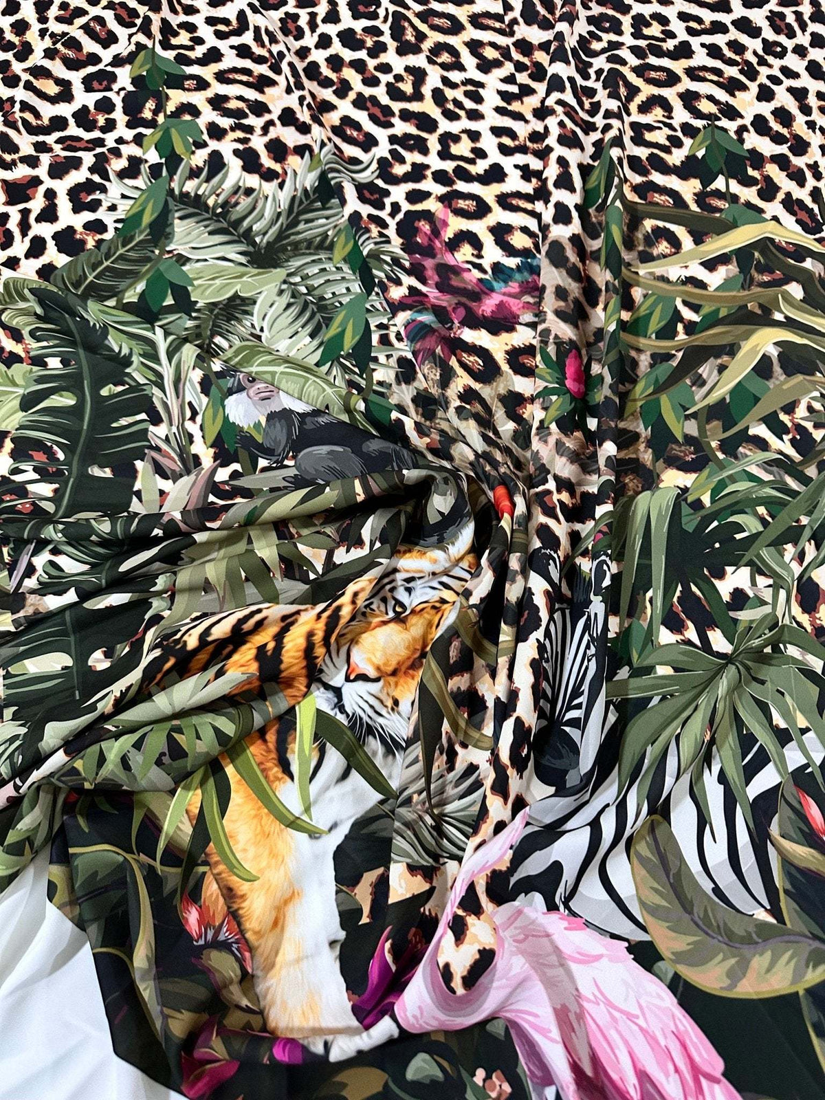 Leopard tropical leaf pattern fabric with jungle animal and floral design on soft durable material