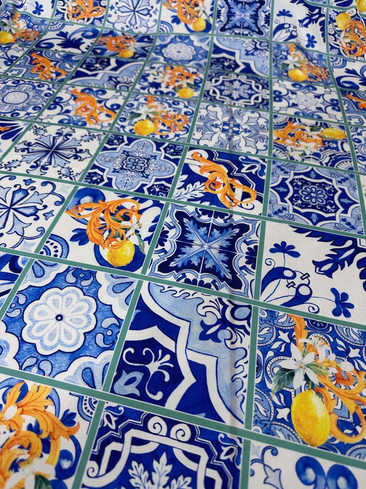 Majolica Lemons Luxury Fabric with vibrant blue and white tiles and citrus lemon motifs in traditional majolica design