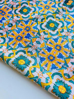 Yellow, blue, and green Mediterranean tile print fabric with intricate geometric pattern, 150cm width, vibrant upholstery and curtain textile
