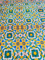 Yellow, blue and green Mediterranean tile pattern fabric with vibrant intricate design and 150cm width
