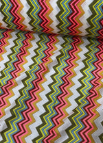 Multicolor zigzag knit jersey mesh fabric with vibrant zigzag pattern for crafting and apparel projects