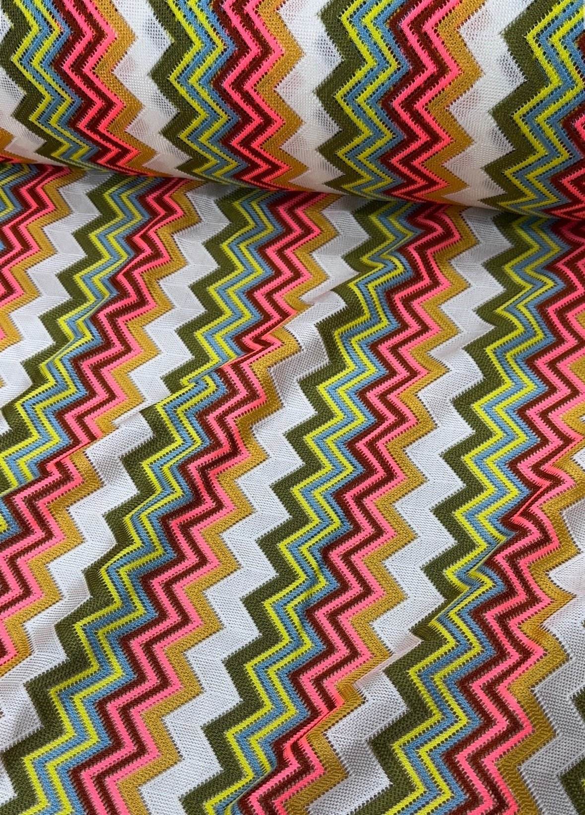 Multicolor zigzag knit jersey mesh fabric with vibrant zigzag pattern for crafting and apparel projects