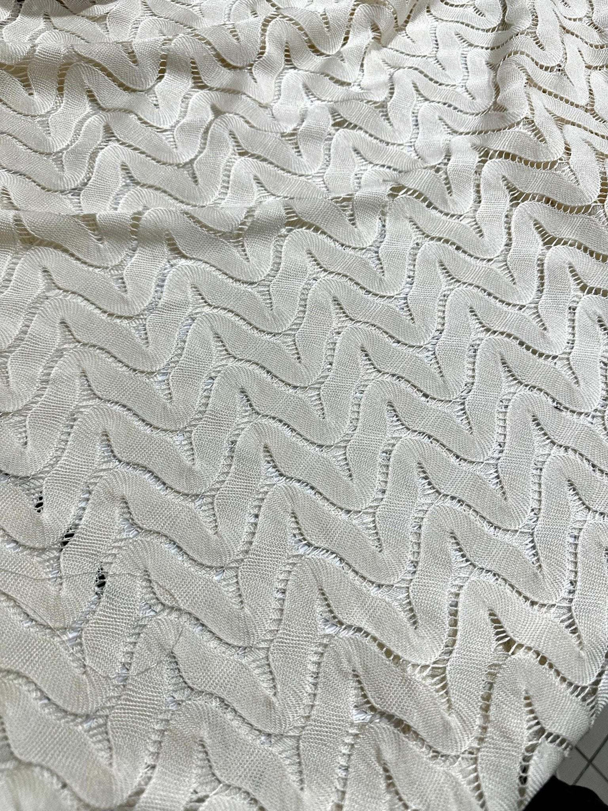 Off-White zigzag knit jersey fabric in breathable mesh with modern pattern and soft texture