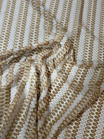 Shimmer Zigzag Knit Jersey fabric in beige and cream chevron pattern with soft texture and lightweight knit ideal for elegant garments