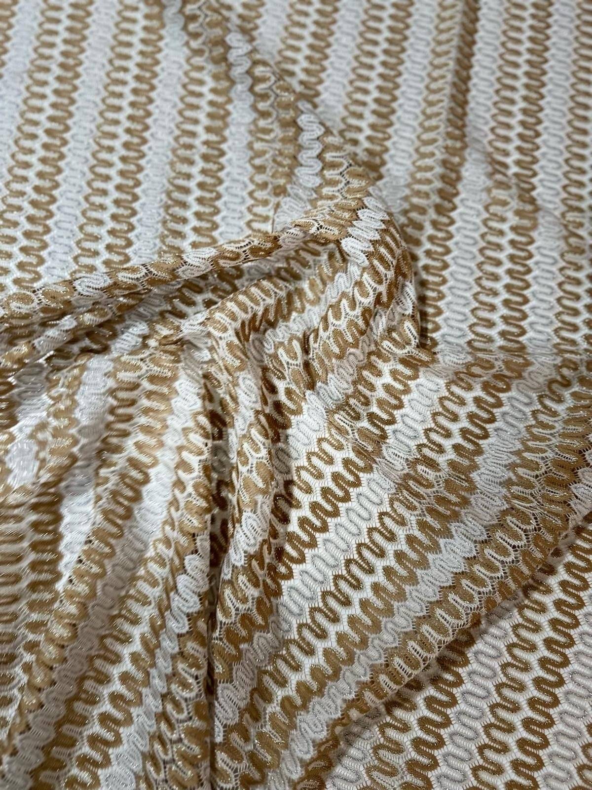 Shimmer Zigzag Knit Jersey fabric in beige and cream chevron pattern with soft texture and lightweight knit ideal for elegant garments