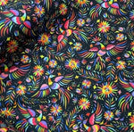 Otomi pattern upholstery fabric with colorful birds and floral designs on black background