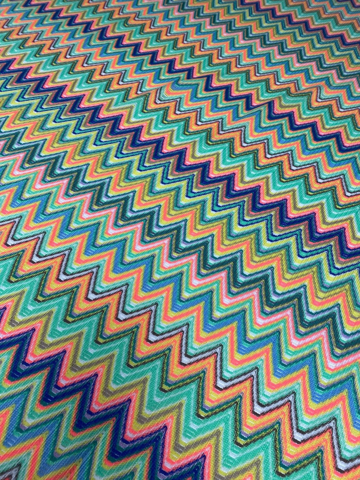 Multicolor chevron zigzag pattern mesh fabric in vibrant green tones for sewing projects