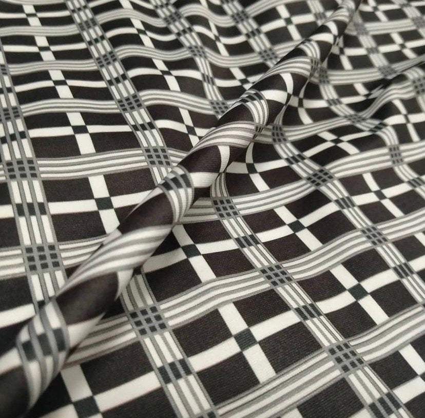Black and white 4-way stretch plaid fabric with a checkered pattern and flexible texture