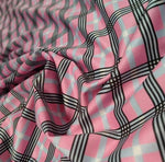 4-way stretch plaid fabric in pink, black, and light blue pattern with flexible texture