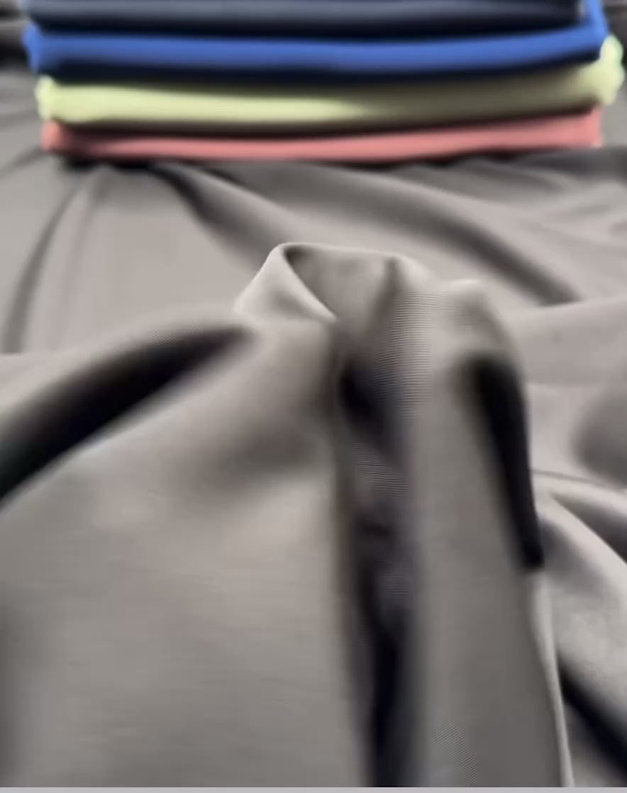 Cotton Modal Fabric by the Metre – Ultra-Soft Breathable Knit for Clothing displayed in various colors.