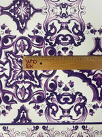 Purple Baroque floral pattern fabric with intricate decorative designs and ruler for scale