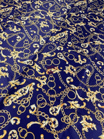 Royal blue fabric with gold chains and baroque scrolls pattern