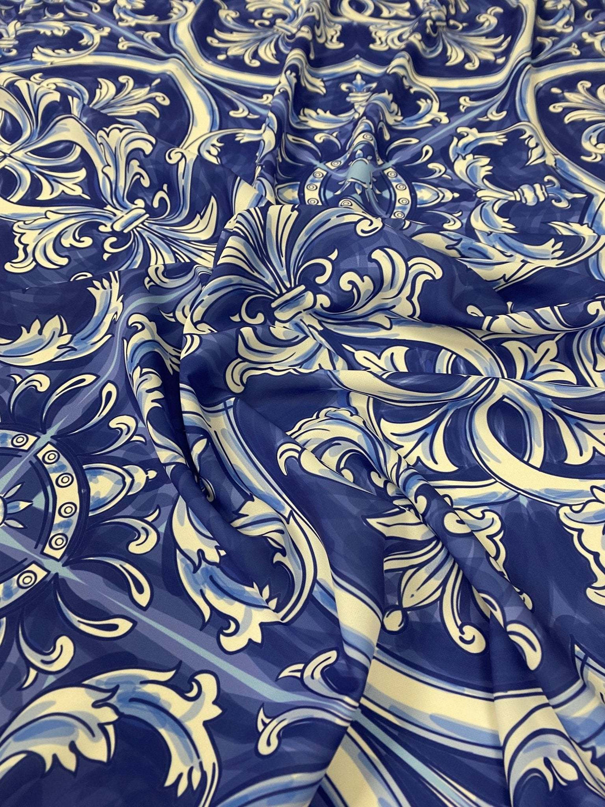 Blue and white Sicilian print fabric with intricate traditional floral and ornamental patterns, soft texture and 150cm width