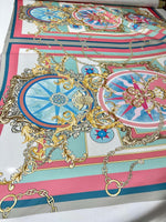Baroque chain pattern fabric with intricate gold and pastel blue and pink designs, ideal for upholstery and drapery