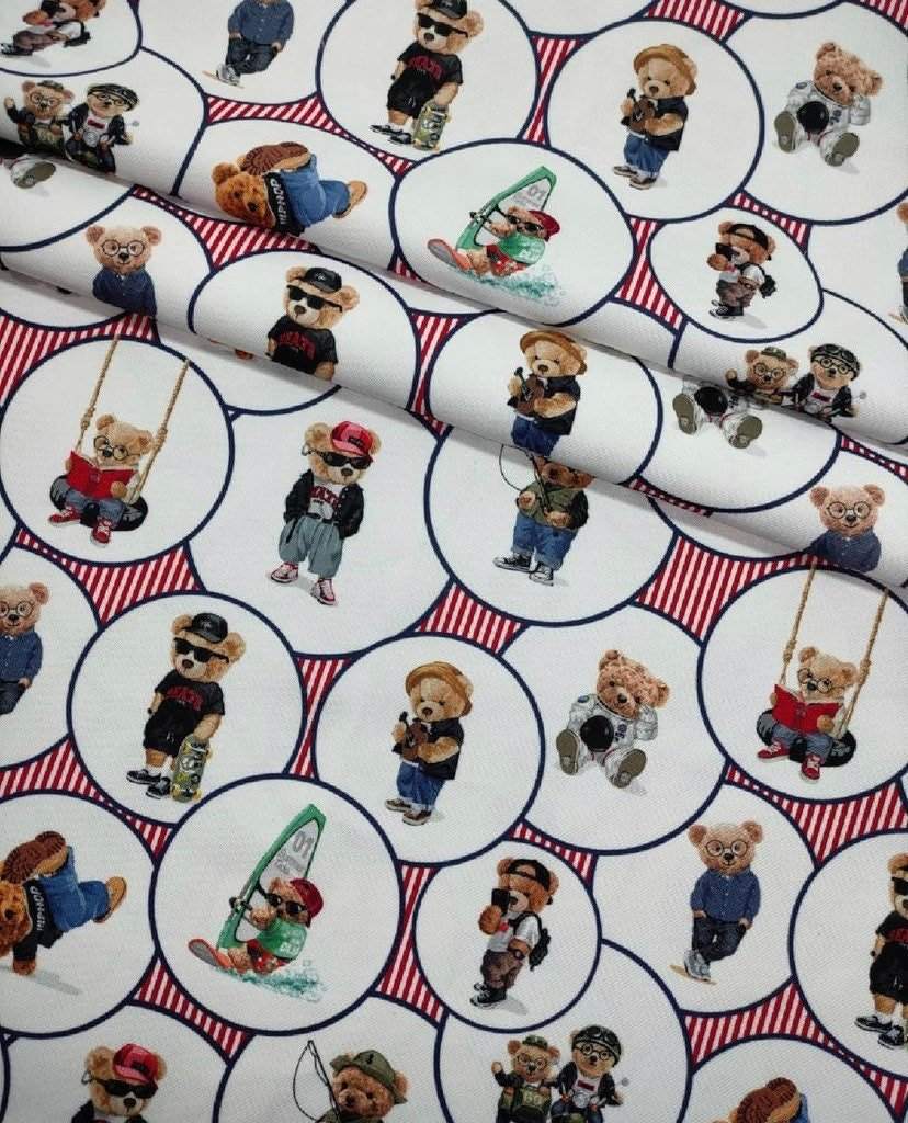 White upholstery fabric with playful digitally printed teddy bear pattern in various outfits and activities, suitable for outdoor use.