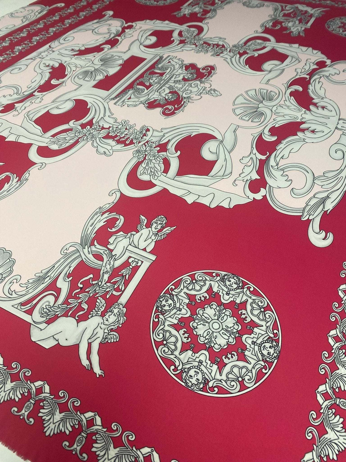 Pink vintage baroque cherub pattern fabric with intricate ornate designs